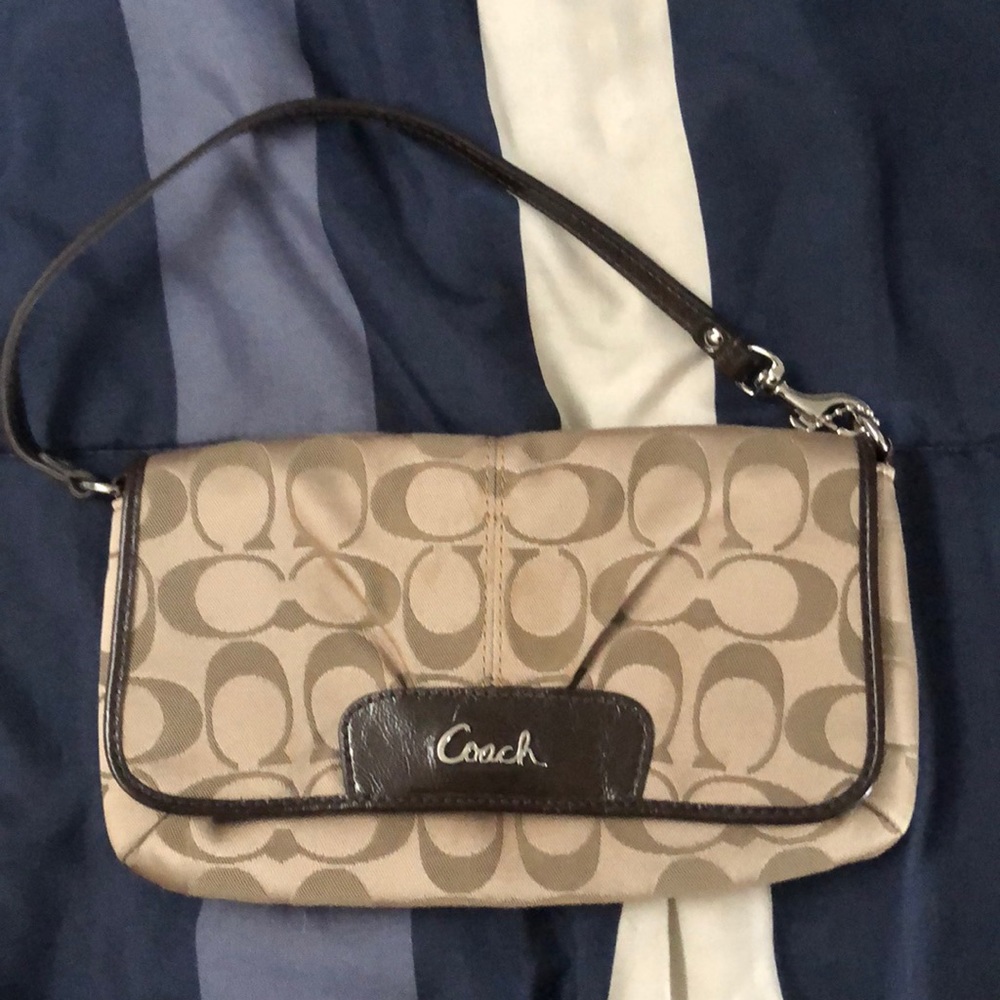 Coach Wristlet fairly new used a hand full